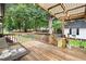 Well-maintained deck features seating and a wooden pergola, offering a relaxing outdoor space at 1418 Mill Path Loop, Lawrenceville, GA 30045