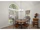 Dining area with large windows and a view of the backyard at 1418 Mill Path Loop, Lawrenceville, GA 30045