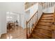 Elegant foyer with hardwood floors, staircase, and view into the dining room at 1418 Mill Path Loop, Lawrenceville, GA 30045