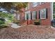 Brick steps lead to the decorative glass-paned front door of this brick two-story home at 1418 Mill Path Loop, Lawrenceville, GA 30045