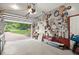 Attached garage featuring an open door, a brick driveway, and a well-organized tool display at 1418 Mill Path Loop, Lawrenceville, GA 30045