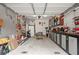 Attached garage featuring a gray floor, an open door, and a well-organized tool display at 1418 Mill Path Loop, Lawrenceville, GA 30045