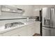 Traditional kitchen featuring white cabinetry, stainless steel appliances, and a gas cooktop at 1418 Mill Path Loop, Lawrenceville, GA 30045