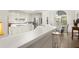 Open kitchen layout featuring a breakfast bar and stainless steel appliances at 1418 Mill Path Loop, Lawrenceville, GA 30045