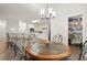 Dining area and kitchen view, featuring bar seating and a well-stocked pantry at 1418 Mill Path Loop, Lawrenceville, GA 30045