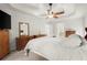 Bright main bedroom showcasing a ceiling fan, and neutral decor at 1418 Mill Path Loop, Lawrenceville, GA 30045
