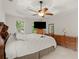 Comfortable main bedroom with a ceiling fan and ample natural light at 1418 Mill Path Loop, Lawrenceville, GA 30045