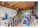 Unfinished shed interior filled with stored items, showcasing ample space for storage and DIY projects at 1418 Mill Path Loop, Lawrenceville, GA 30045