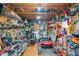 Interior view of shed featuring a motorcycle, lawn mower, and tools, highlighting organized storage at 1418 Mill Path Loop, Lawrenceville, GA 30045