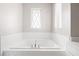 This bathroom offers a large tub next to a window at 164 Blakemore Dr, Smyrna, GA 30080
