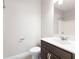Clean bathroom featuring a vanity with a dark wood cabinet, white countertop, and a shower-tub combo at 164 Blakemore Dr, Smyrna, GA 30080