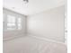 The bedroom offers several windows and neutral colors at 164 Blakemore Dr, Smyrna, GA 30080