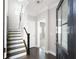 Inviting entryway featuring a staircase, hardwood floors, neutral walls, and a stylish front door at 164 Blakemore Dr, Smyrna, GA 30080