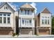 Charming townhome with a stone facade, second story balcony, and attached garage in a desirable location at 164 Blakemore Dr, Smyrna, GA 30080