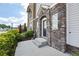 This exterior shows a stone elevation with a sidewalk leading to the door at 164 Blakemore Dr, Smyrna, GA 30080