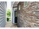 Stone wall facade leads to a black door with a glass insert at 164 Blakemore Dr, Smyrna, GA 30080