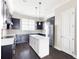 Modern kitchen with dark cabinets, stainless steel appliances, and a central island at 164 Blakemore Dr, Smyrna, GA 30080