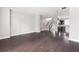 Spacious living area with hardwood floors and an open layout, leading to the kitchen and staircase at 164 Blakemore Dr, Smyrna, GA 30080