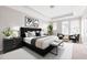 This main bedroom offers a sitting area, black paneled bed frame, and plenty of light at 164 Blakemore Dr, Smyrna, GA 30080