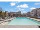 Community pool surrounded by lounge chairs and pergola shaded area at 164 Blakemore Dr, Smyrna, GA 30080