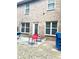 Cozy backyard patio with chairs, accessible via a glass door, surrounded by a brick exterior at 2691 Pointcrest Way, Grayson, GA 30017