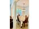 Elegant dining room with a classic chandelier, a large window, and stylish table setting at 2691 Pointcrest Way, Grayson, GA 30017