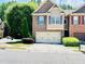 Charming townhome with brick facade, two-car garage and well-manicured landscaping at 2691 Pointcrest Way, Grayson, GA 30017