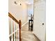 Inviting foyer featuring wood-look floors and staircase, leading to the home's main living areas at 2691 Pointcrest Way, Grayson, GA 30017