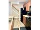 Functional kitchen with dark appliances, laminate countertops, and convenient access to the staircase at 2691 Pointcrest Way, Grayson, GA 30017