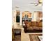 Comfortable living room with plush sofa and view into kitchen at 2691 Pointcrest Way, Grayson, GA 30017
