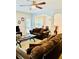 Open-concept living room featuring comfortable seating and natural light flowing into the dining area at 2691 Pointcrest Way, Grayson, GA 30017