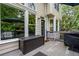 Cozy back deck area with seating, umbrella, and outdoor storage box at 3220 Millwood Trl, Smyrna, GA 30080
