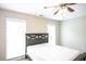 Bedroom with bright natural light from two windows and simple decor at 620 River Mist Dr, Jonesboro, GA 30238