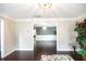 Spacious living room showing hardwood floors with view to formal dining at 620 River Mist Dr, Jonesboro, GA 30238