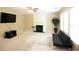 Open living room featuring neutral walls, a fireplace, ceiling fan and large window at 620 River Mist Dr, Jonesboro, GA 30238