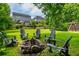 Large backyard featuring a fire pit, Adirondack chairs, and play set perfect for outdoor gatherings at 1282 Kendrick Ne Rd, Brookhaven, GA 30319