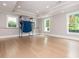 Finished basement with hardwood floors, recessed lighting, and bright windows to the backyard at 1282 Kendrick Ne Rd, Brookhaven, GA 30319