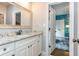 Bathroom view from the door showcasing sink, granite countertops, and door to bedroom at 1282 Kendrick Ne Rd, Brookhaven, GA 30319