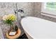 Close-up of freestanding tub with modern fixtures and stylish decor at 1282 Kendrick Ne Rd, Brookhaven, GA 30319