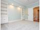 Comfortable bedroom featuring bright walls, carpet, and stylish built-in shelving and drawers at 1282 Kendrick Ne Rd, Brookhaven, GA 30319