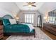 Stylish bedroom with vaulted ceiling, plush bedding, and abundant natural light at 1282 Kendrick Ne Rd, Brookhaven, GA 30319