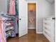 Spacious walk-in closet featuring custom shelving, drawers, and ample storage space for clothing at 1282 Kendrick Ne Rd, Brookhaven, GA 30319