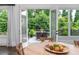 Outdoor deck featuring a dining set with views of the lush backyard at 1282 Kendrick Ne Rd, Brookhaven, GA 30319