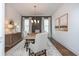 Elegant dining room with hardwood floors, modern chandelier, and stylish decor at 1282 Kendrick Ne Rd, Brookhaven, GA 30319