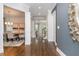 Bright foyer with hardwood floors, elegant trim, and views into the dining room and staircase at 1282 Kendrick Ne Rd, Brookhaven, GA 30319