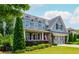 Charming two-story home featuring a well-manicured lawn, beautiful landscaping and a gray accent garage at 1282 Kendrick Ne Rd, Brookhaven, GA 30319