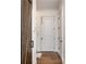 Hallway featuring hardwood floors, and a sliding barn door accent at 1282 Kendrick Ne Rd, Brookhaven, GA 30319