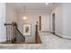 Upstairs hallway with decorative lighting, wooden staircase and carpet at 1282 Kendrick Ne Rd, Brookhaven, GA 30319