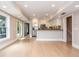 Open-concept kitchen features stainless steel appliances, white cabinetry, and hardwood floors at 1282 Kendrick Ne Rd, Brookhaven, GA 30319