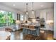 Gourmet kitchen with granite countertops, stainless appliances, island seating, and hardwood floors at 1282 Kendrick Ne Rd, Brookhaven, GA 30319